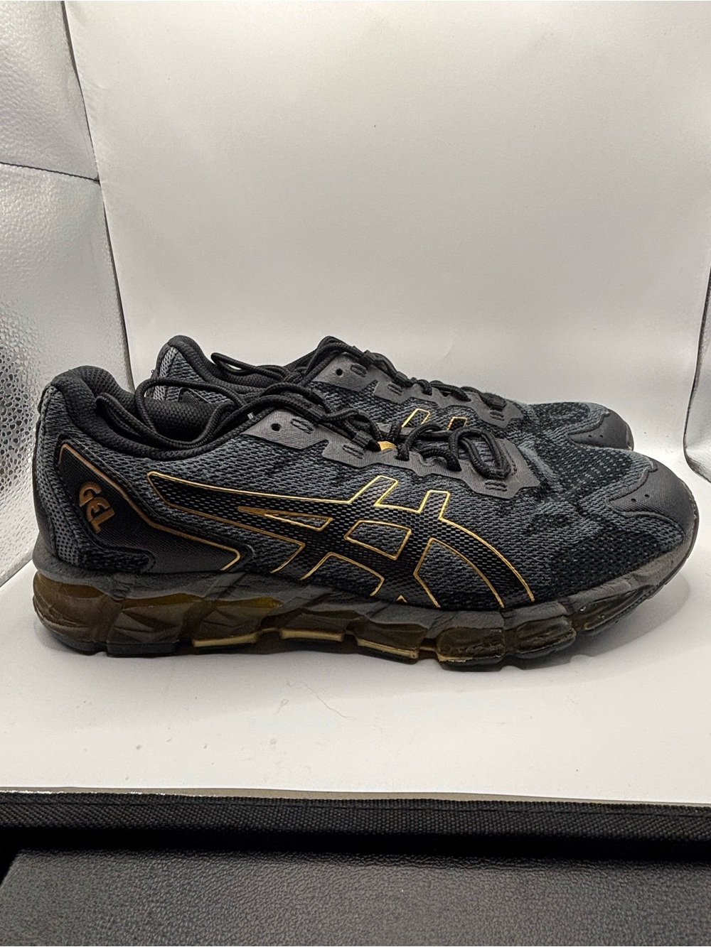 Asics Men's Black Athletic Sneakers with Gold Trim